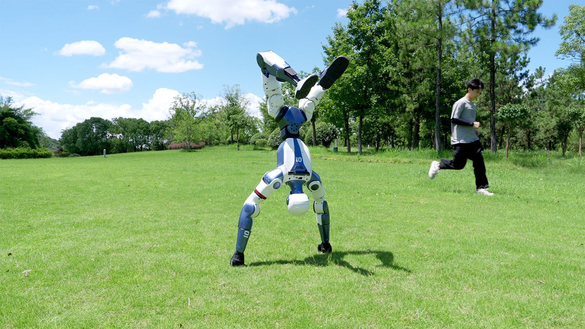 Unitree R1 cartwheel on a lawn